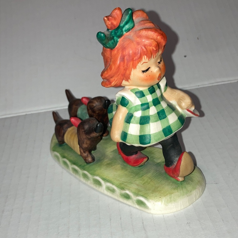 Vintage Goebel Putting on the Dogs Girl Figurine in Green Dress with Puppies